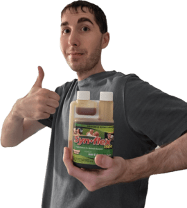 Author holding a bottle of Synflex 1500 Formula giving the thumbs up